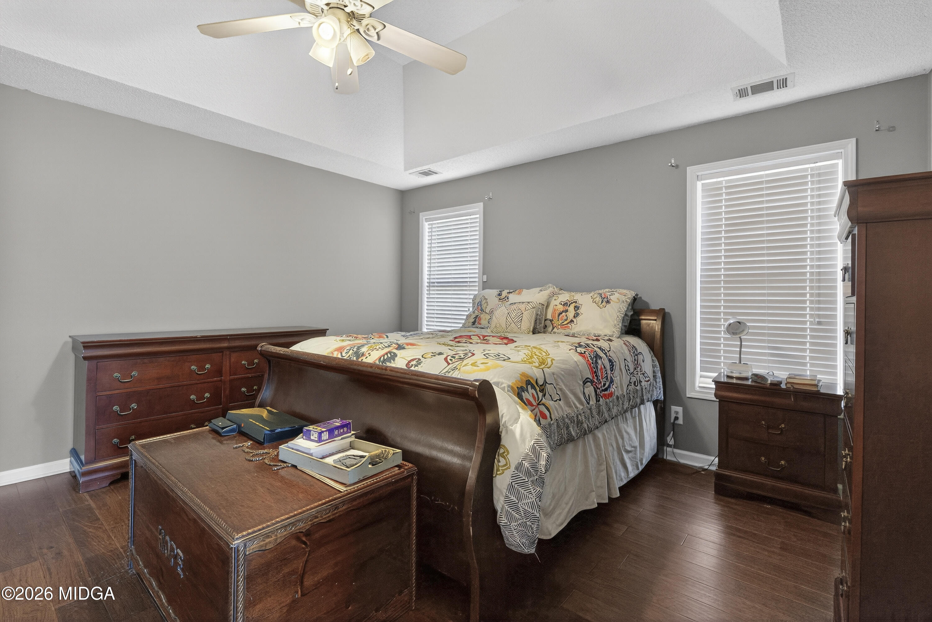 249 Southern Walk Circle Gray, GA 31032 - Photo 39 of 58 a bedroom with a bed and a chandelier