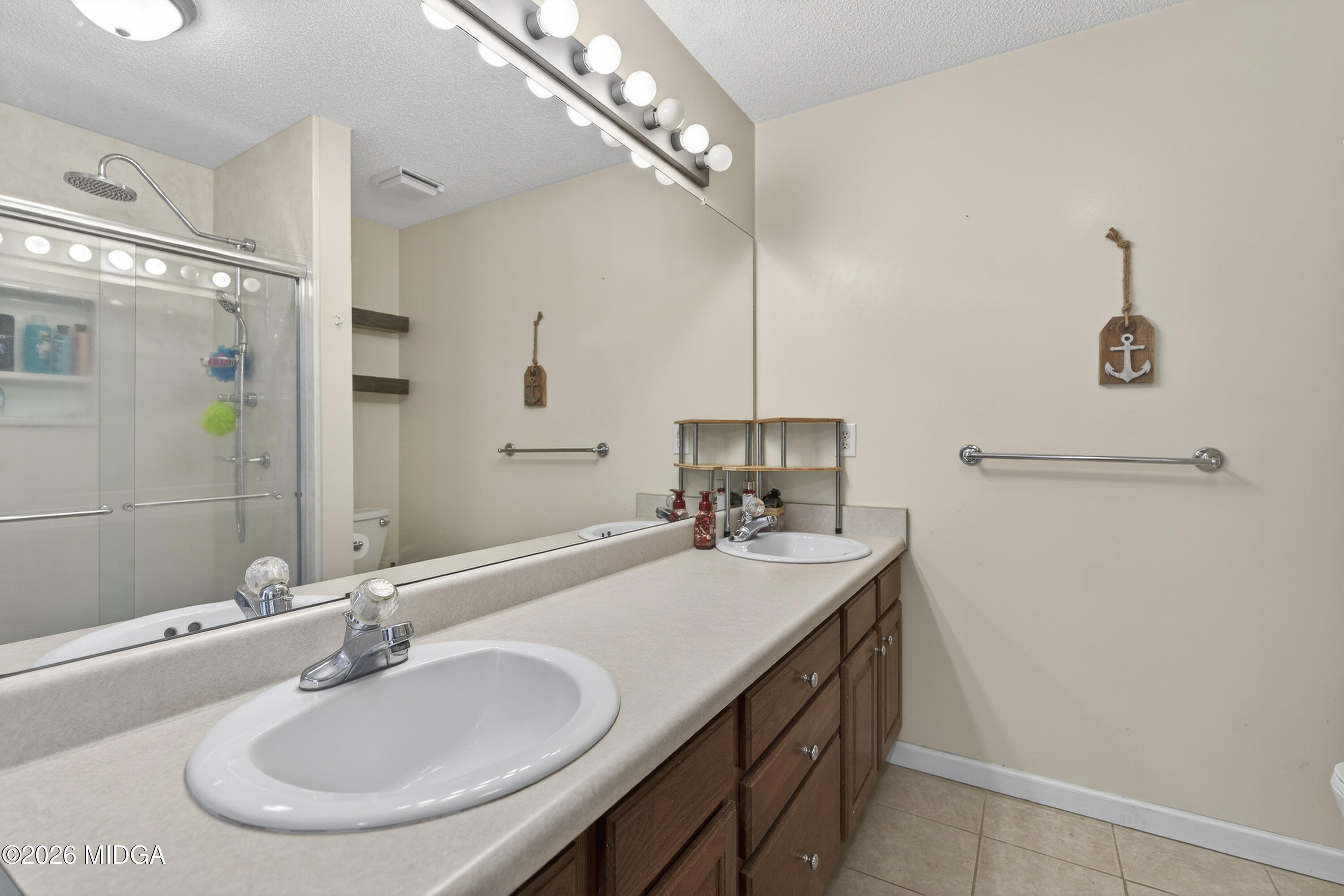 249 Southern Walk Circle Gray, GA 31032 - Photo 41 of 58 a bathroom with a sink and a mirror