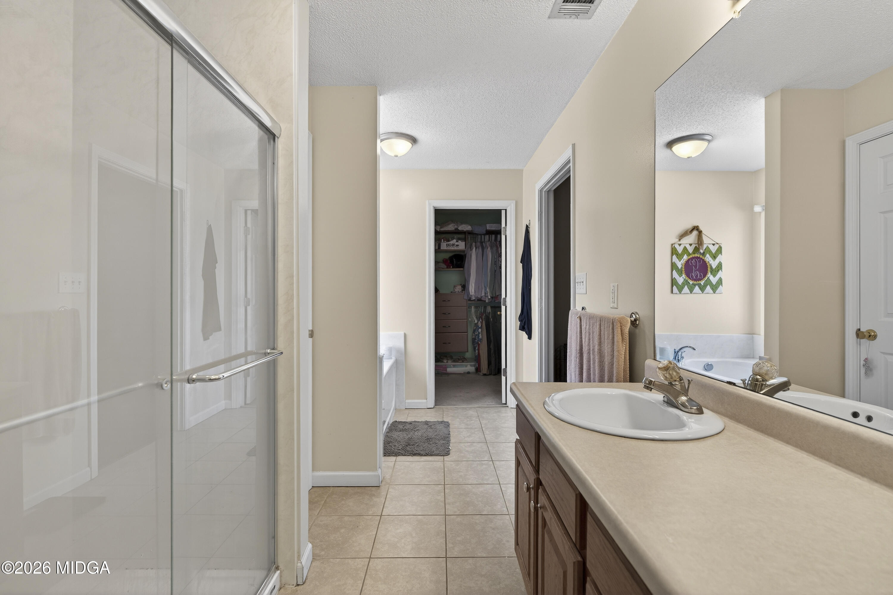 249 Southern Walk Circle Gray, GA 31032 - Photo 42 of 58 a bathroom with a granite countertop sink and a mirror