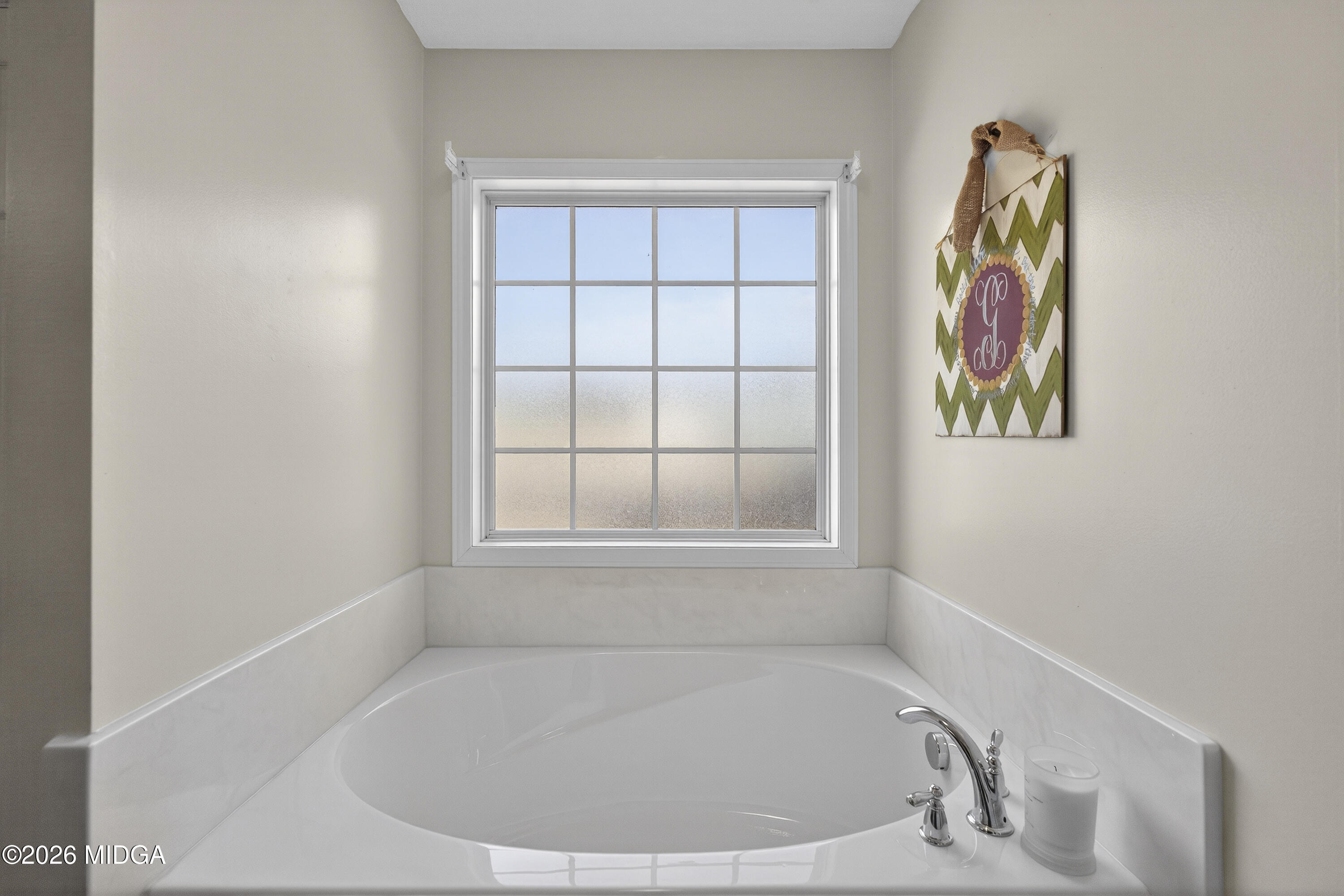 249 Southern Walk Circle Gray, GA 31032 - Photo 43 of 58 a white bath tub sitting in a bathroom next to a window