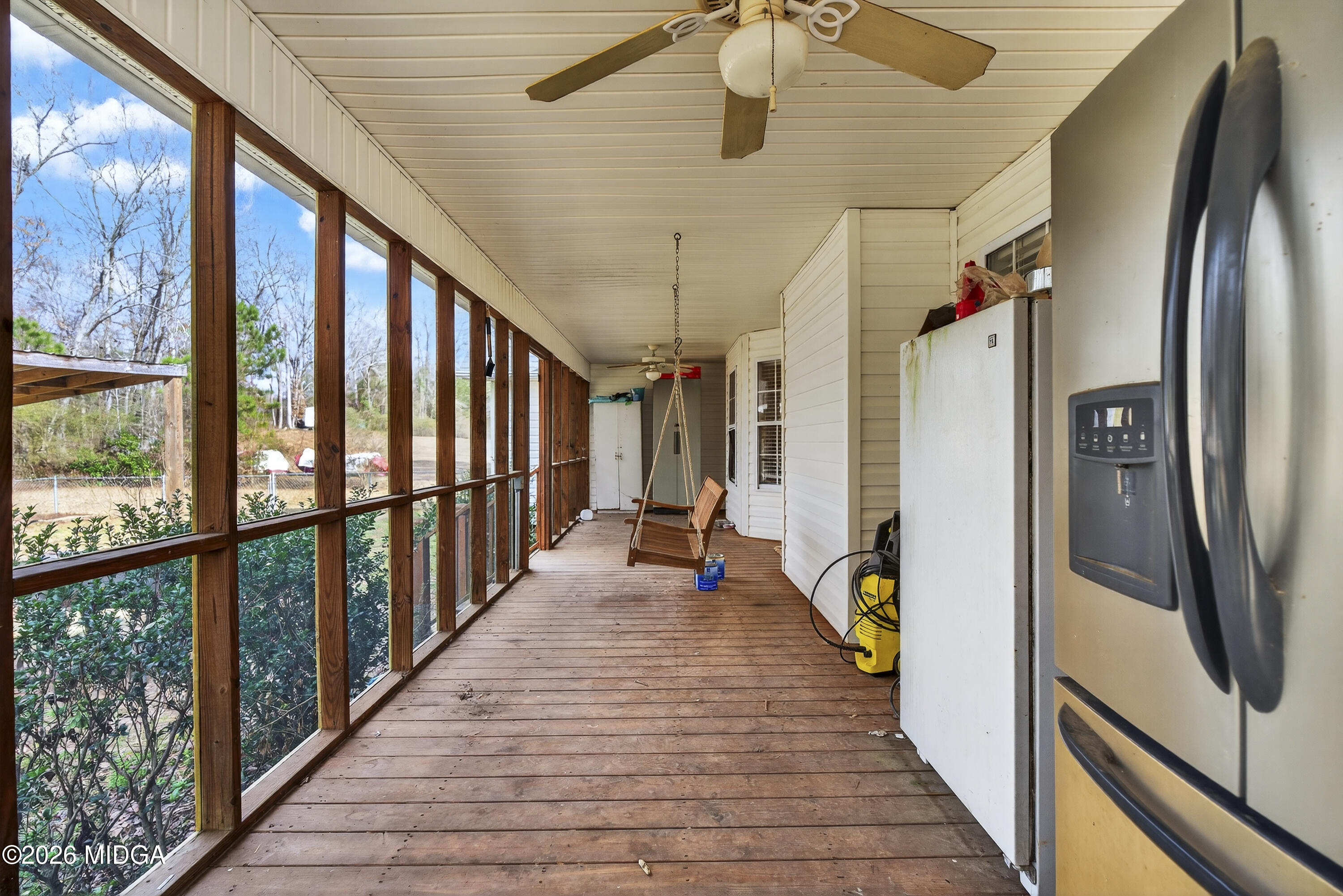 249 Southern Walk Circle Gray, GA 31032 - Photo 50 of 58 a view of a hallway with wooden floor and staircase