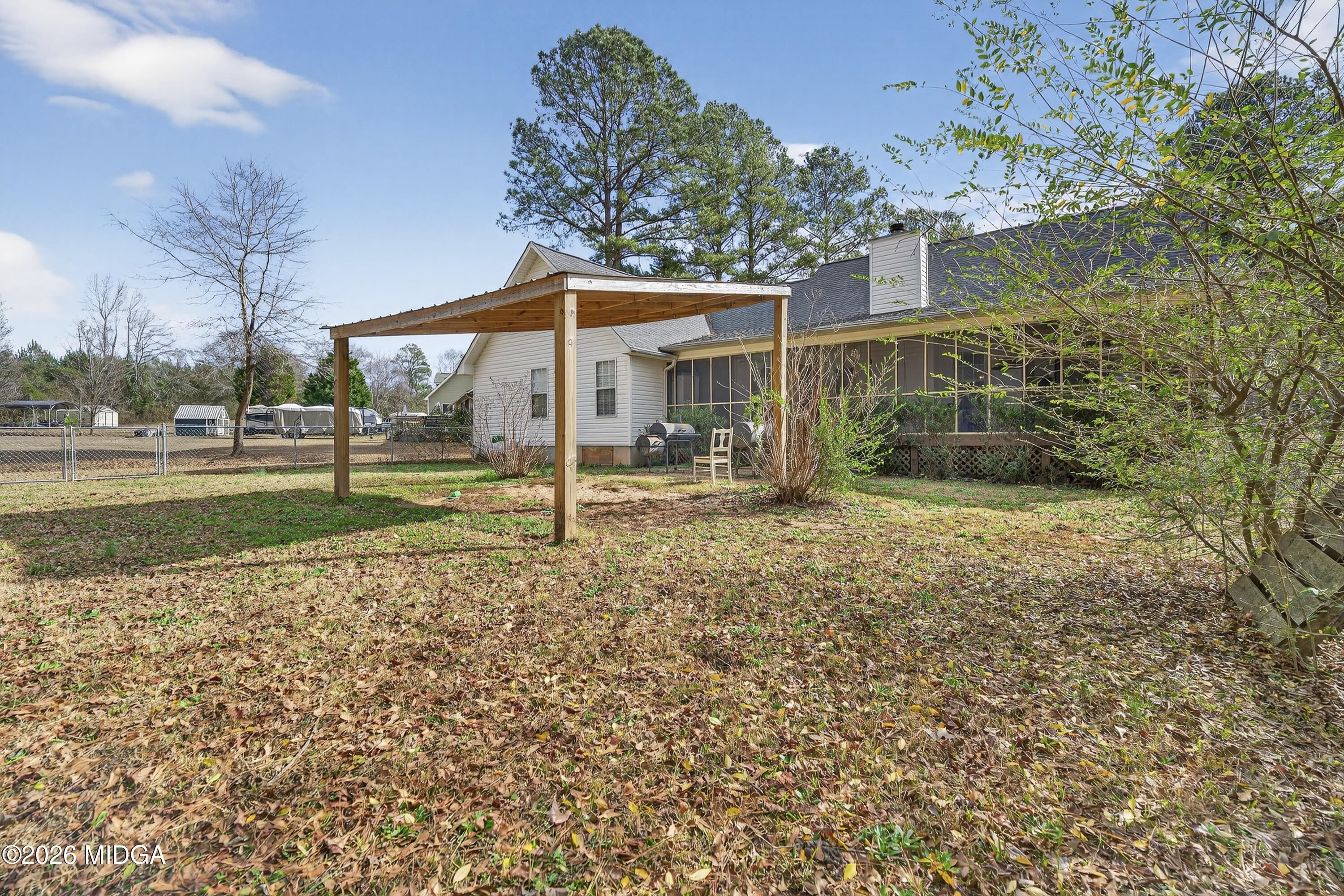 249 Southern Walk Circle Gray, GA 31032 - Photo 54 of 58 a view of a house with backyard and a tree