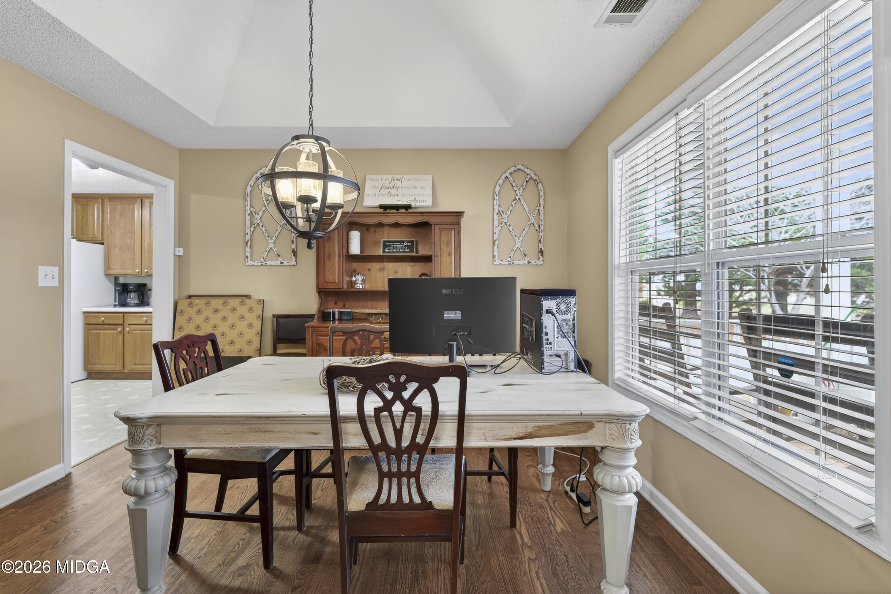 249 Southern Walk Circle Gray, GA 31032 - Photo 10 of 58 a view of a dining room with furniture window and wooden floor