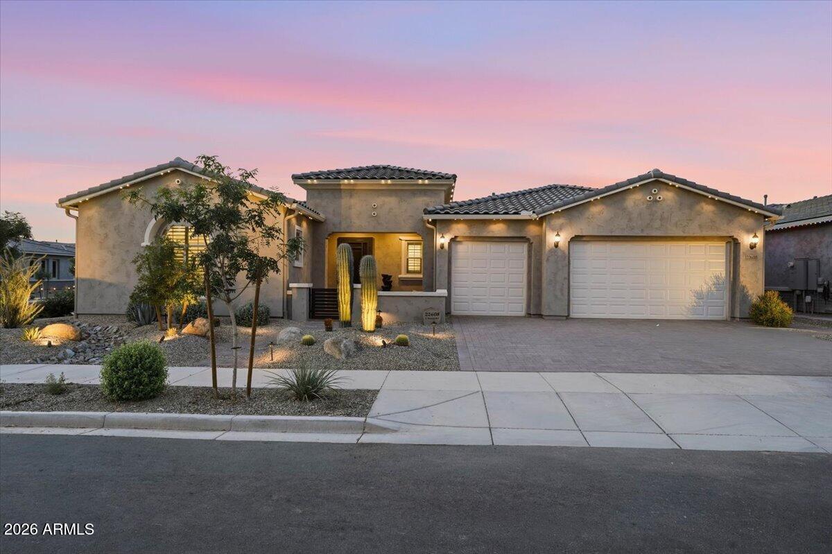 22608 East Stacey Road Queen Creek, AZ 85142 - Photo 2 of 83 a front view of a house with a yard and garage