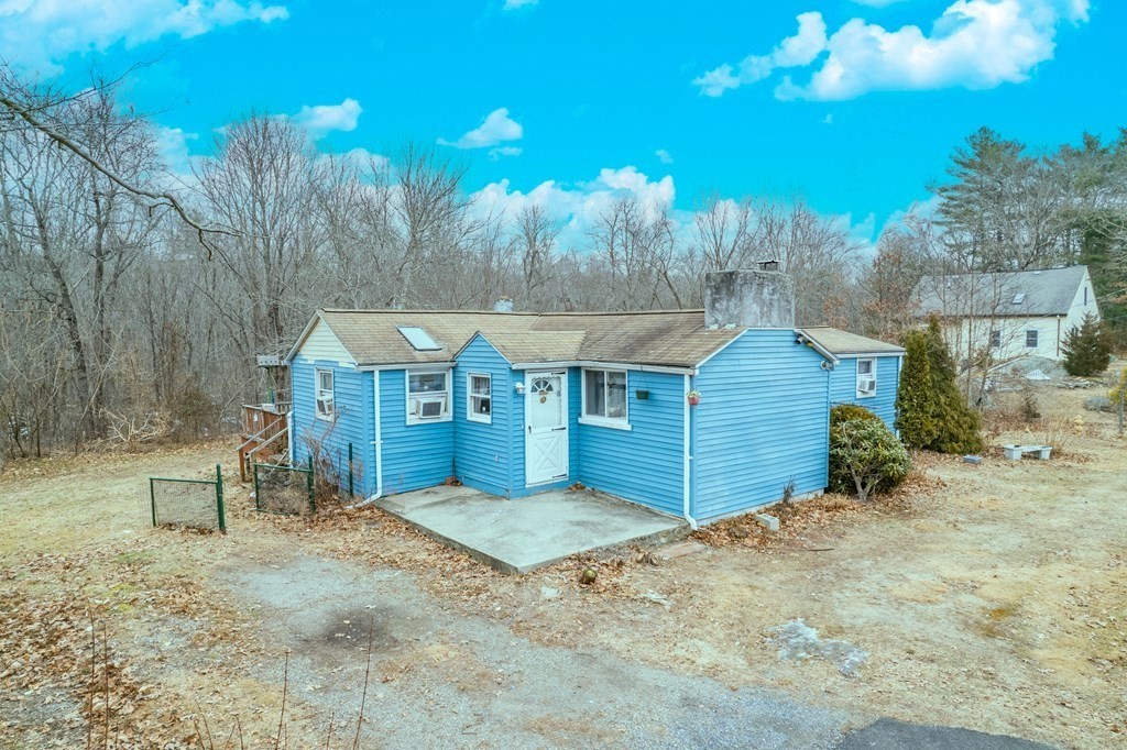 74 Winthrop Street Rehoboth, MA 02769 - Photo 1 of 8 a view of a house with a yard and sitting area