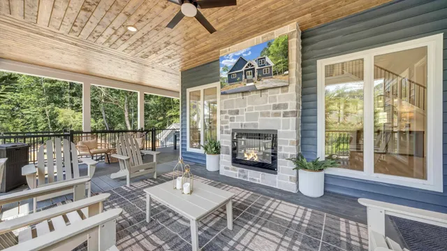 a view of a patio with a dining table and chairs