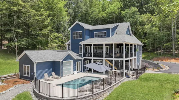 swimming pool view with a seating space