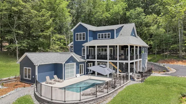 swimming pool view with a seating space