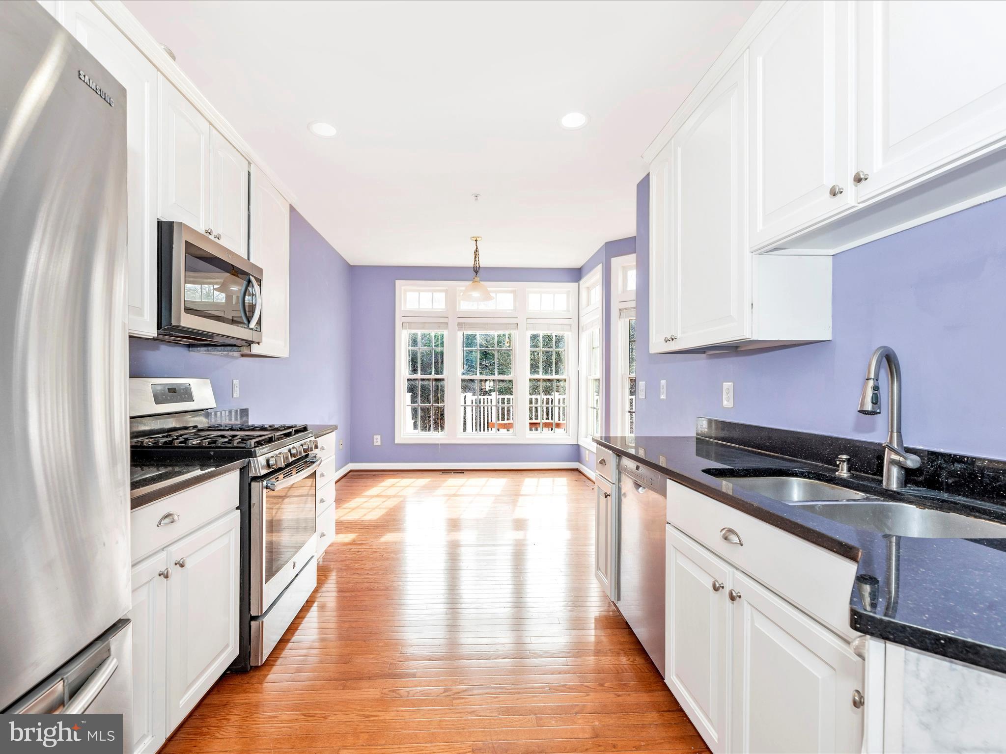 10811 Wadsworth Road Woodstock, MD 21163 - Photo 11 of 66 a kitchen with granite countertop a sink and steel appliances
