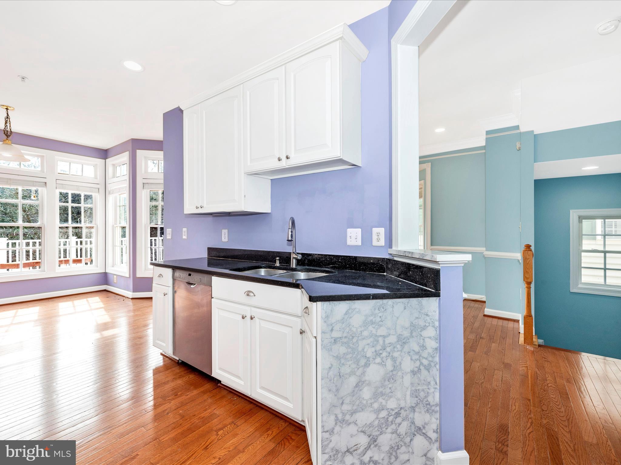 10811 Wadsworth Road Woodstock, MD 21163 - Photo 12 of 66 a kitchen with stainless steel appliances granite countertop a stove and a wooden floors