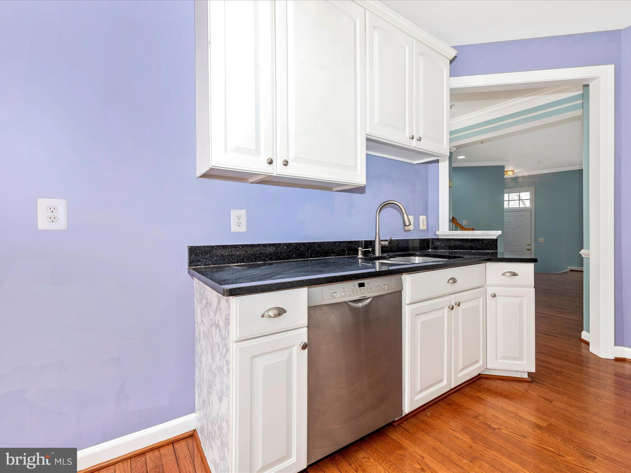 10811 Wadsworth Road Woodstock, MD 21163 - Photo 18 of 66 a kitchen with granite countertop white cabinets and a granite counter tops
