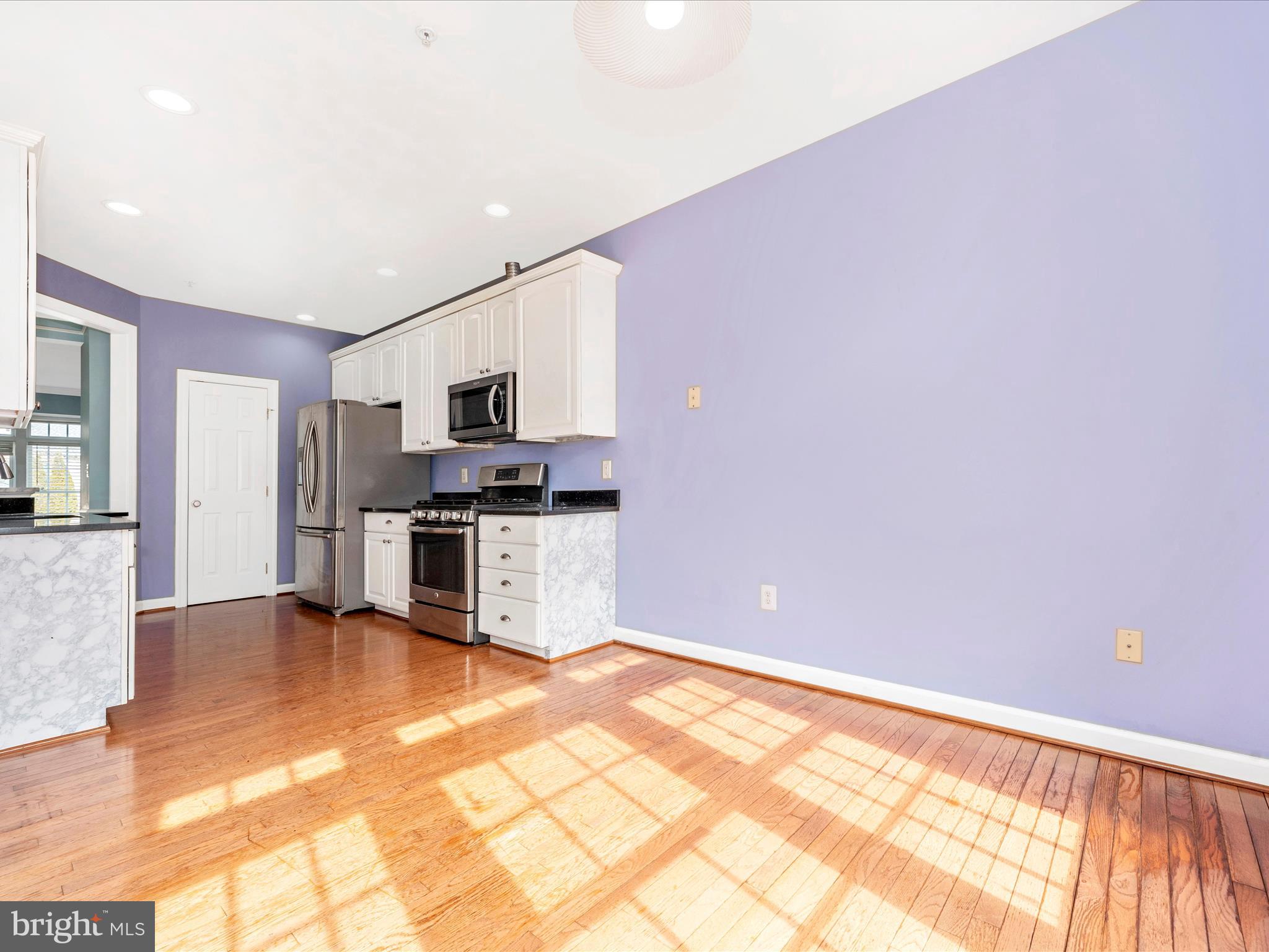 10811 Wadsworth Road Woodstock, MD 21163 - Photo 23 of 66 a view of kitchen with microwave and cabinets