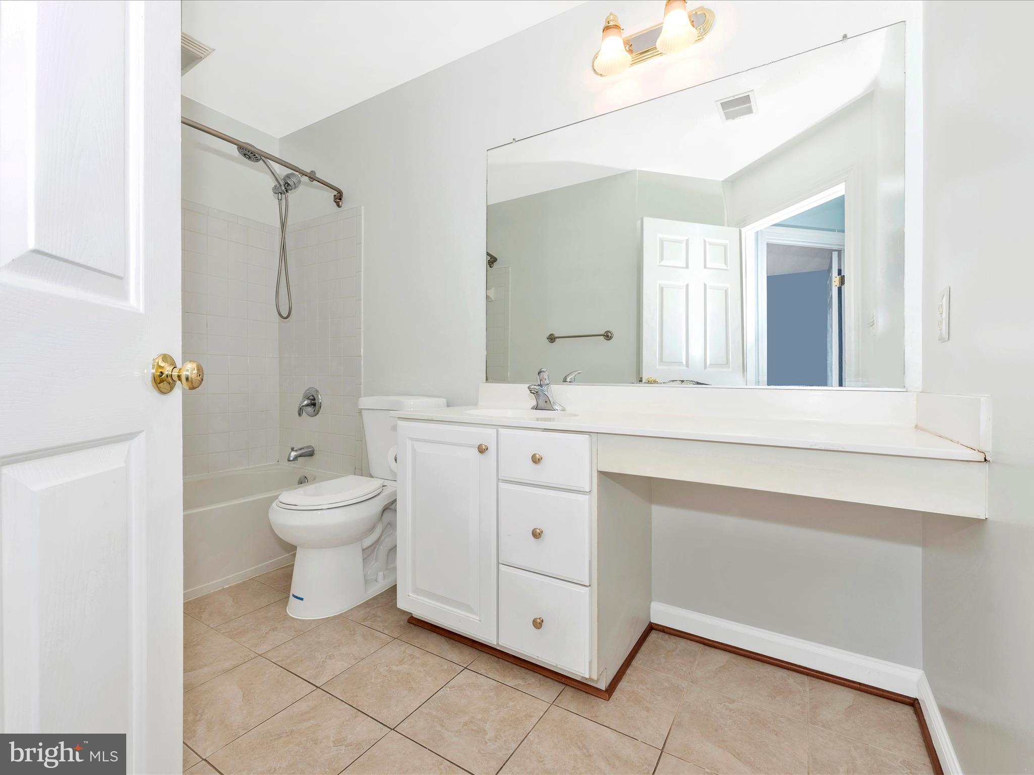 10811 Wadsworth Road Woodstock, MD 21163 - Photo 34 of 66 a bathroom with a sink toilet and shower
