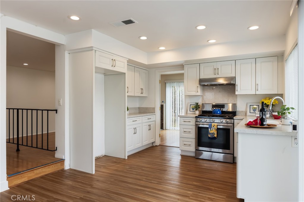 20233 Campaign Drive Carson, CA 90746 - Photo 15 of 44 a kitchen with stainless steel appliances granite countertop a refrigerator and a stove top oven