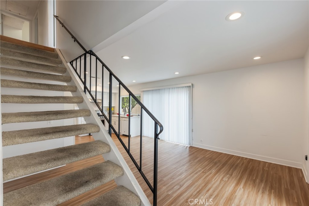 20233 Campaign Drive Carson, CA 90746 - Photo 20 of 44 a view of staircase with wooden floor and a floor to ceiling window