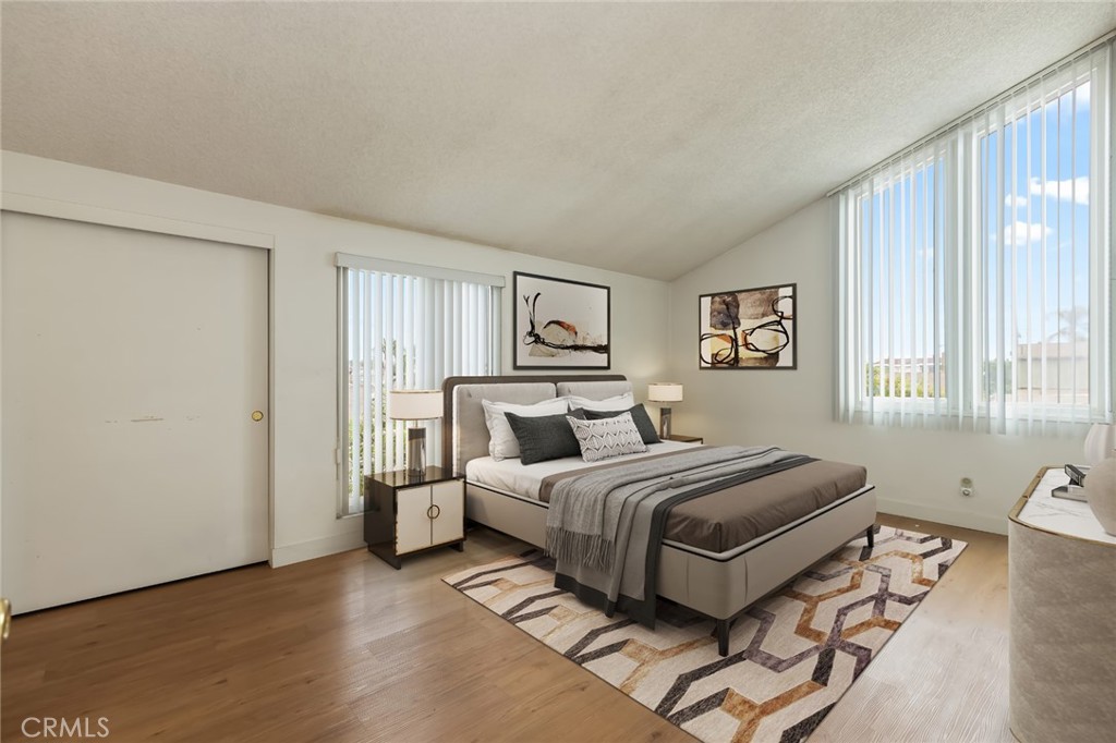 20233 Campaign Drive Carson, CA 90746 - Photo 22 of 44 a bedroom with a large bed and a window