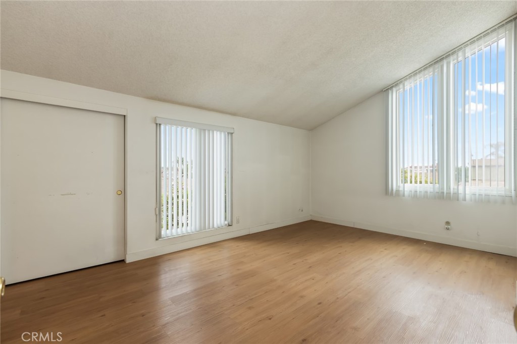 20233 Campaign Drive Carson, CA 90746 - Photo 23 of 44 an empty room with wooden floor and windows