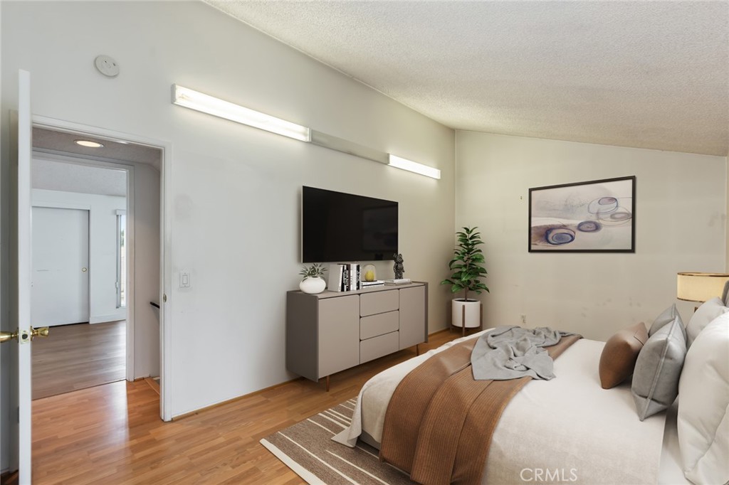 20233 Campaign Drive Carson, CA 90746 - Photo 28 of 44 a bedroom with a bed and a flat screen tv