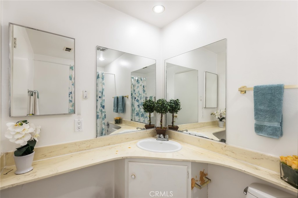 20233 Campaign Drive Carson, CA 90746 - Photo 30 of 44 a bathroom with a sink and a mirror