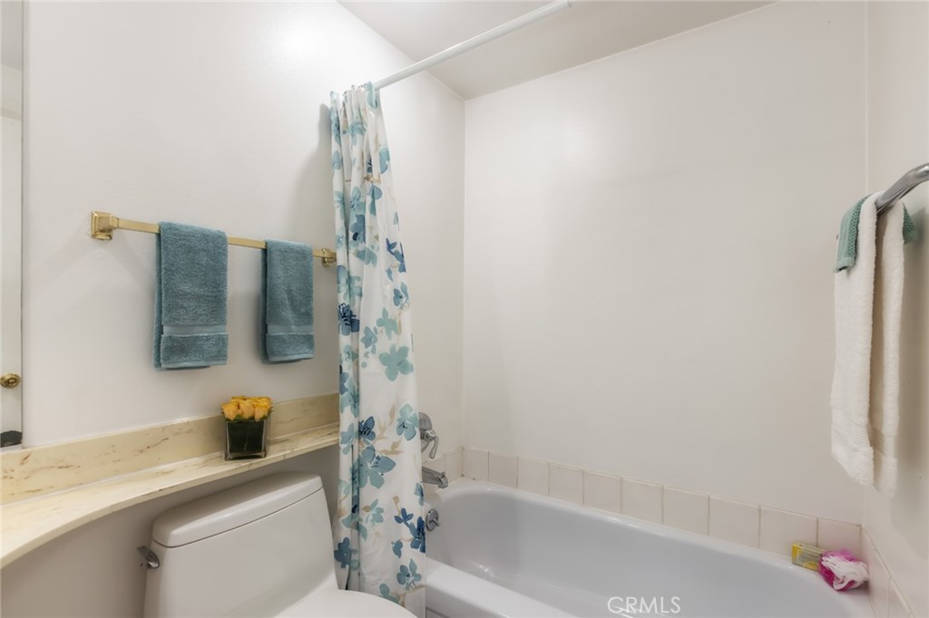 20233 Campaign Drive Carson, CA 90746 - Photo 31 of 44 a bathroom with a sink a toilet and shower