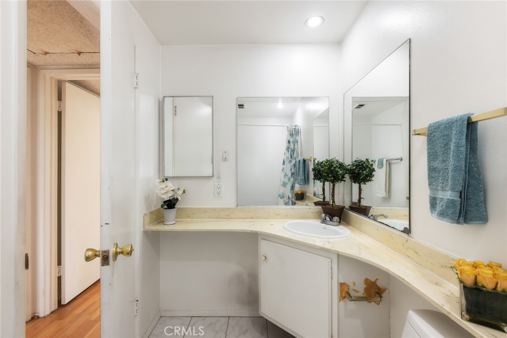 20233 Campaign Drive Carson, CA 90746 - Photo 32 of 44 a bathroom with a sink and a mirror