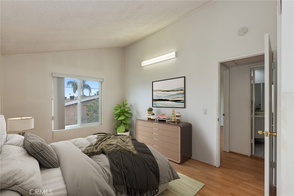 20233 Campaign Drive Carson, CA 90746 - Photo 33 of 44 a bedroom with a bed and wooden floor