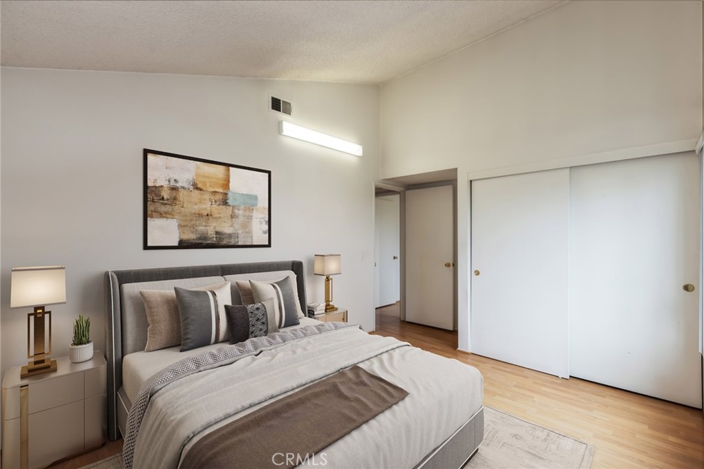 20233 Campaign Drive Carson, CA 90746 - Photo 34 of 44 a bedroom with a bed and wooden floor