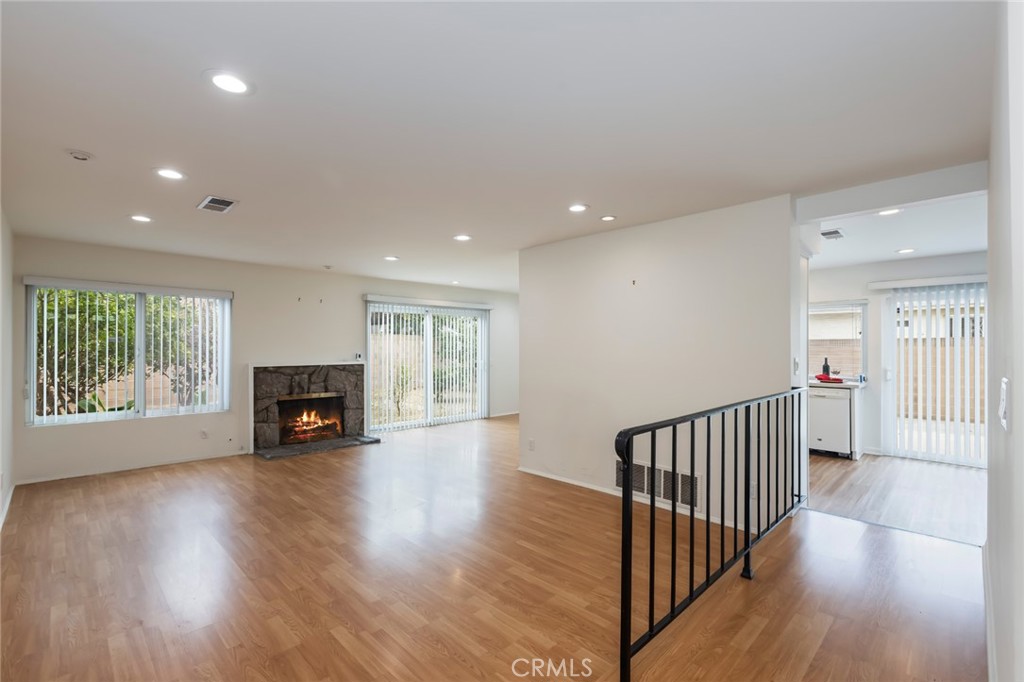 20233 Campaign Drive Carson, CA 90746 - Photo 5 of 44 a view of empty room with wooden floor and fireplace