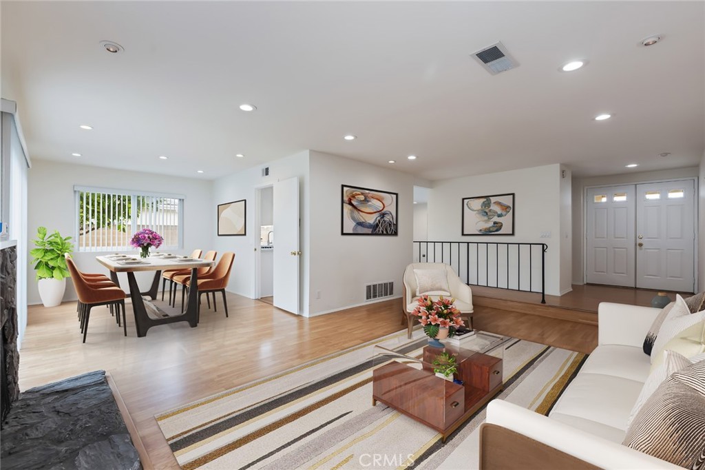 20233 Campaign Drive Carson, CA 90746 - Photo 6 of 44 a living room with furniture and a dining table with wooden floor