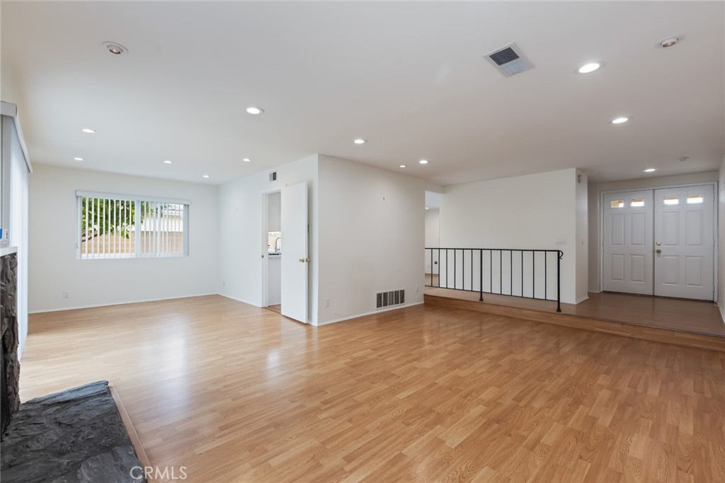 20233 Campaign Drive Carson, CA 90746 - Photo 7 of 44 an empty room with wooden floor and windows