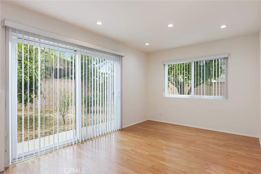 20233 Campaign Drive Carson, CA 90746 - Photo 8 of 44 a view of an empty room with wooden floor and a window