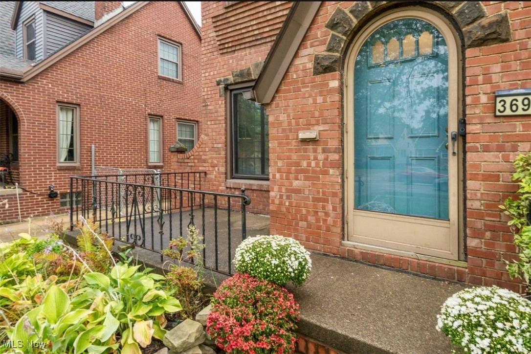3693 Warren Road Cleveland, OH 44111 - Photo 32 of 37 View of exterior entry featuring brick siding