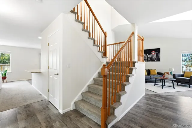 a view of entryway and hall with wooden floor