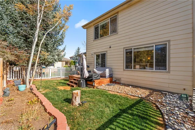 a backyard of a house with seating space