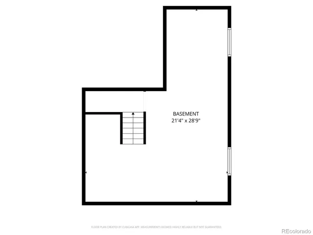 a picture of a bench in front of a wall