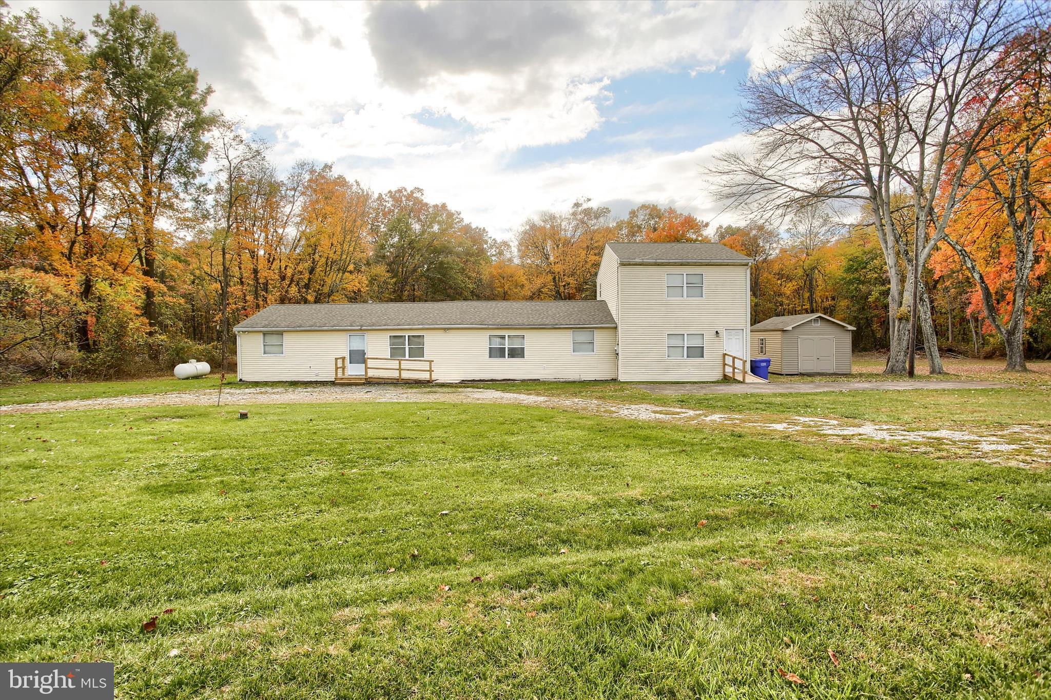 859 Pinetown Road Lewisberry, PA 17339 - Photo 1 of 51 a view of a swimming pool with an outdoor space and seating area