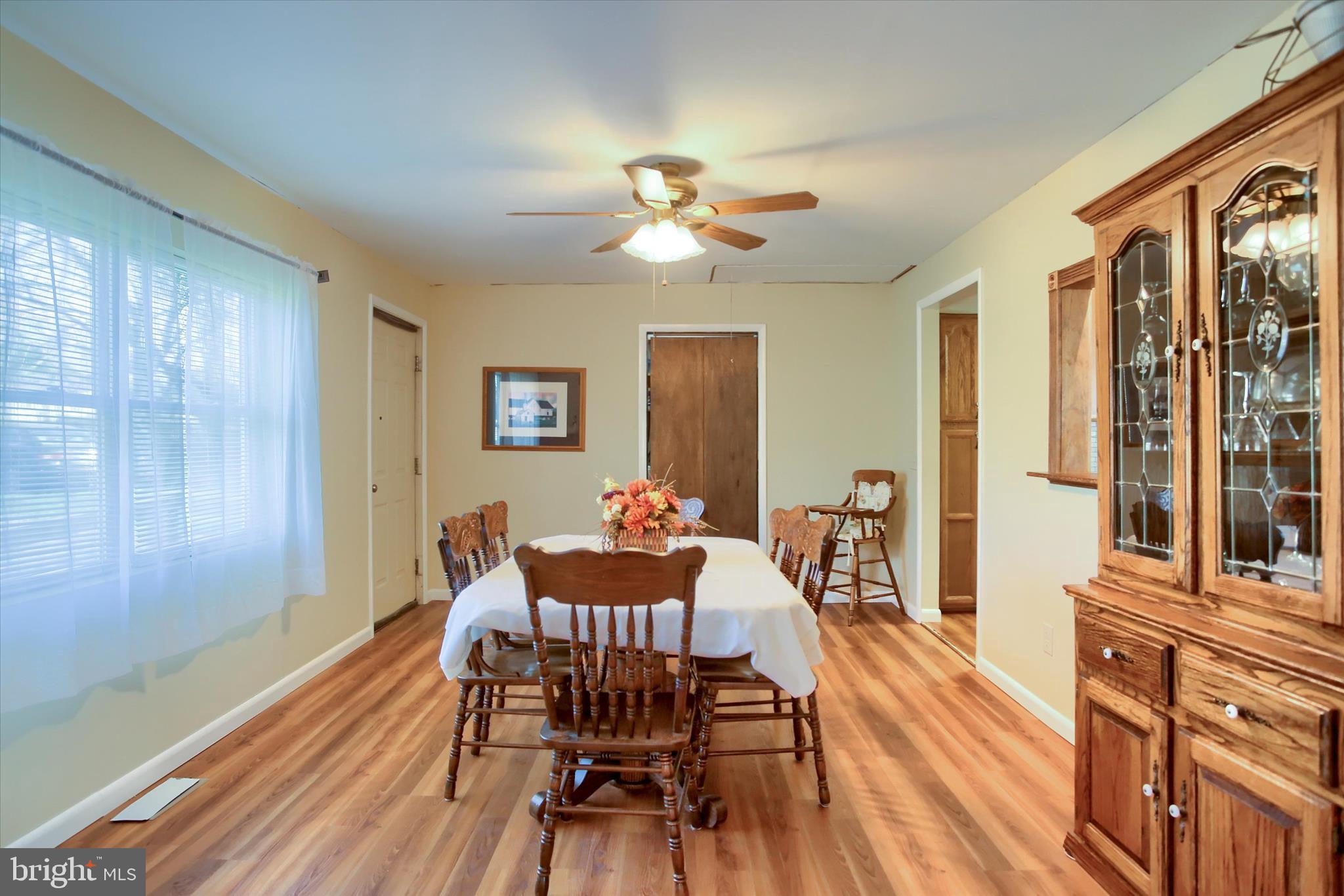 859 Pinetown Road Lewisberry, PA 17339 - Photo 11 of 51 a dining room with furniture a chandelier and wooden floor