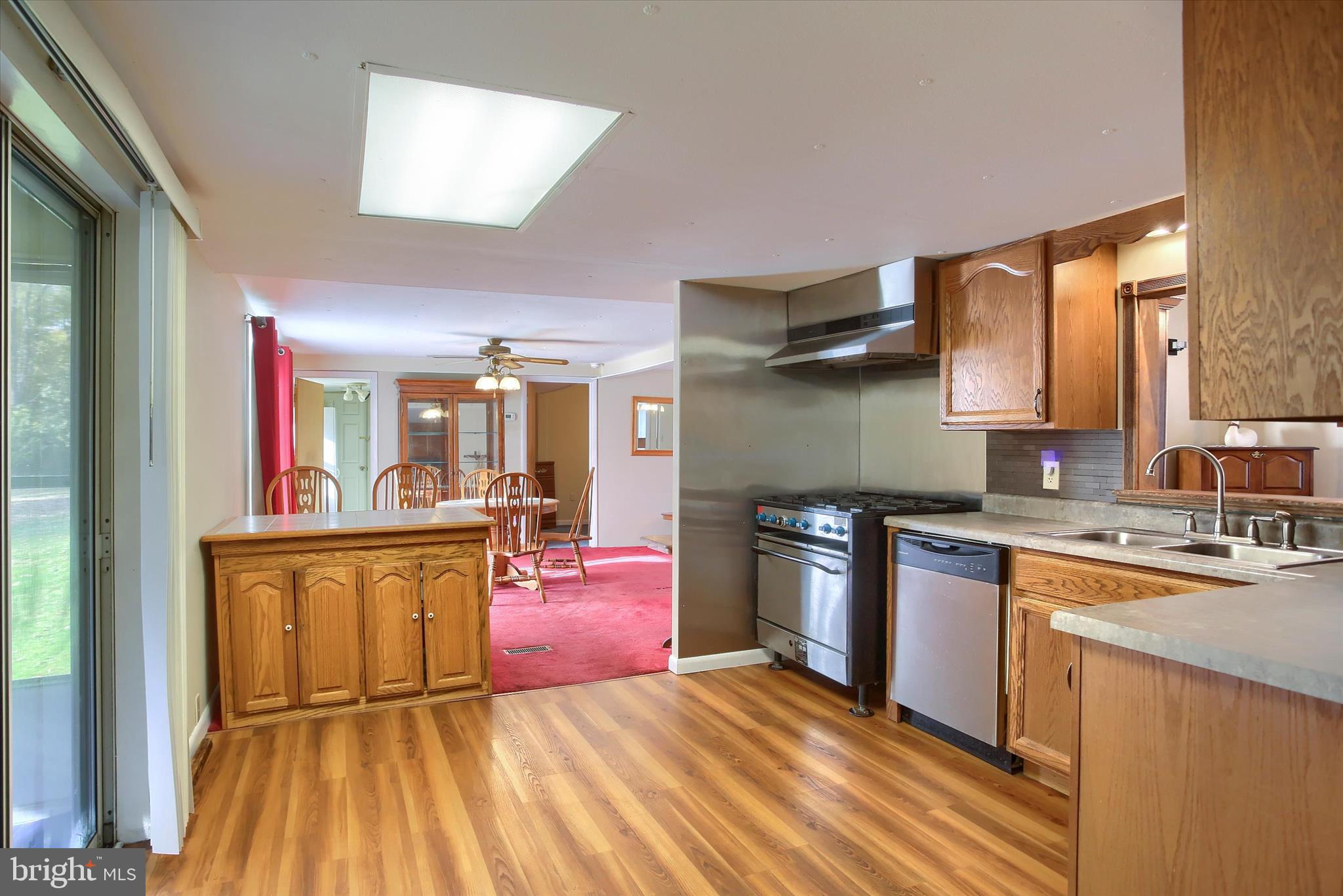 859 Pinetown Road Lewisberry, PA 17339 - Photo 16 of 51 a kitchen with stainless steel appliances granite countertop a sink stove and refrigerator