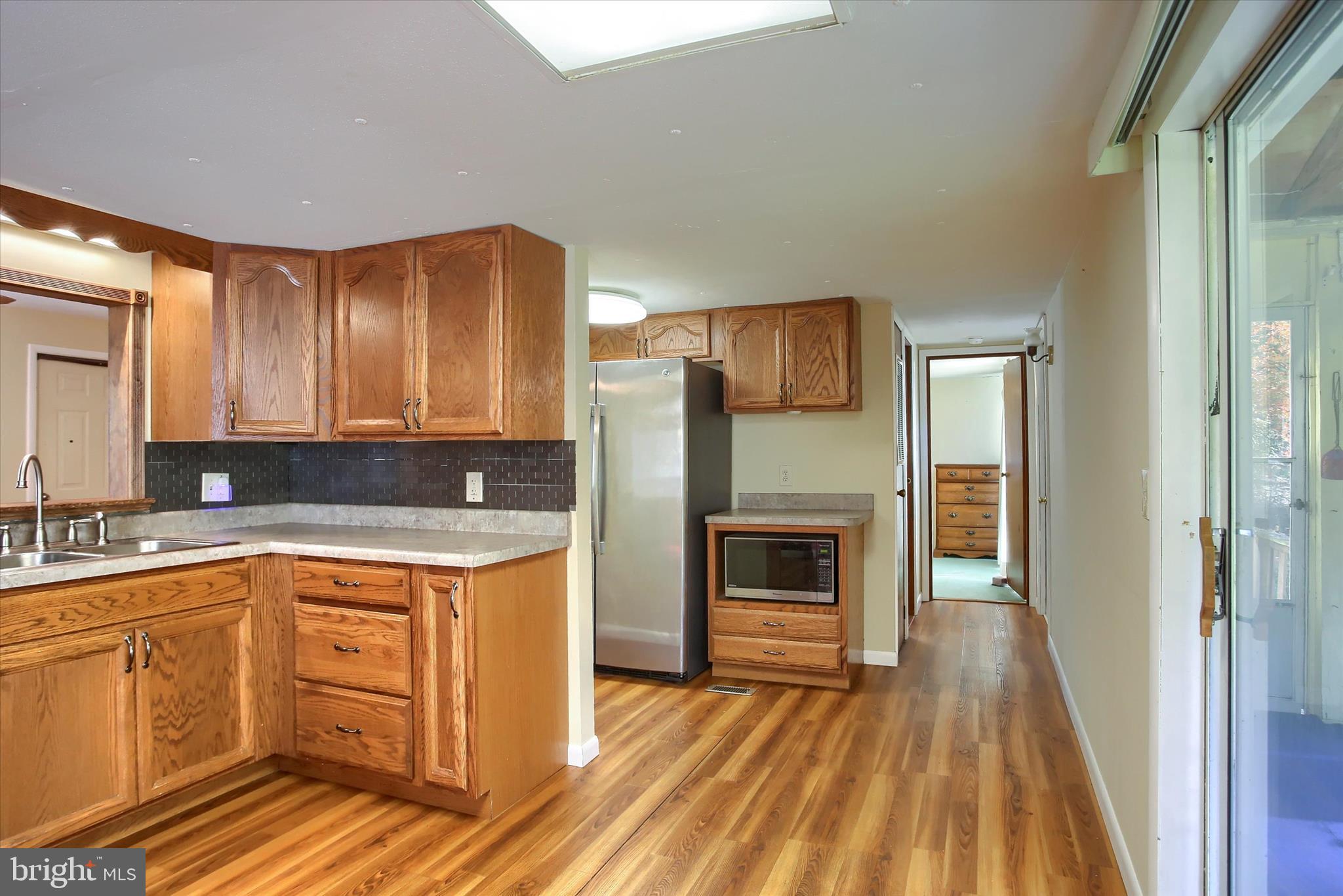 859 Pinetown Road Lewisberry, PA 17339 - Photo 18 of 51 a kitchen with a refrigerator sink and cabinets