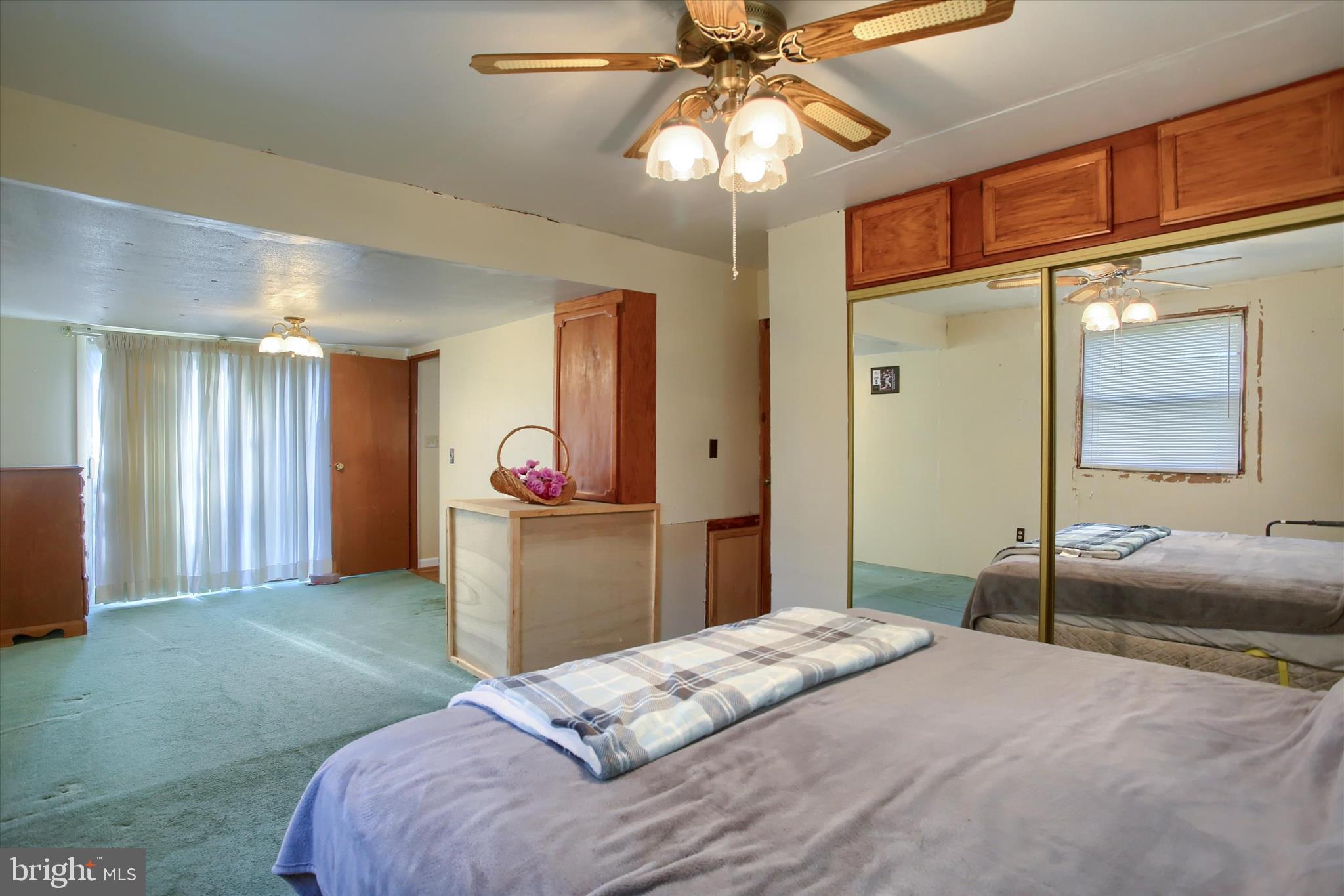 859 Pinetown Road Lewisberry, PA 17339 - Photo 24 of 51 a bedroom with a bed and a chandelier