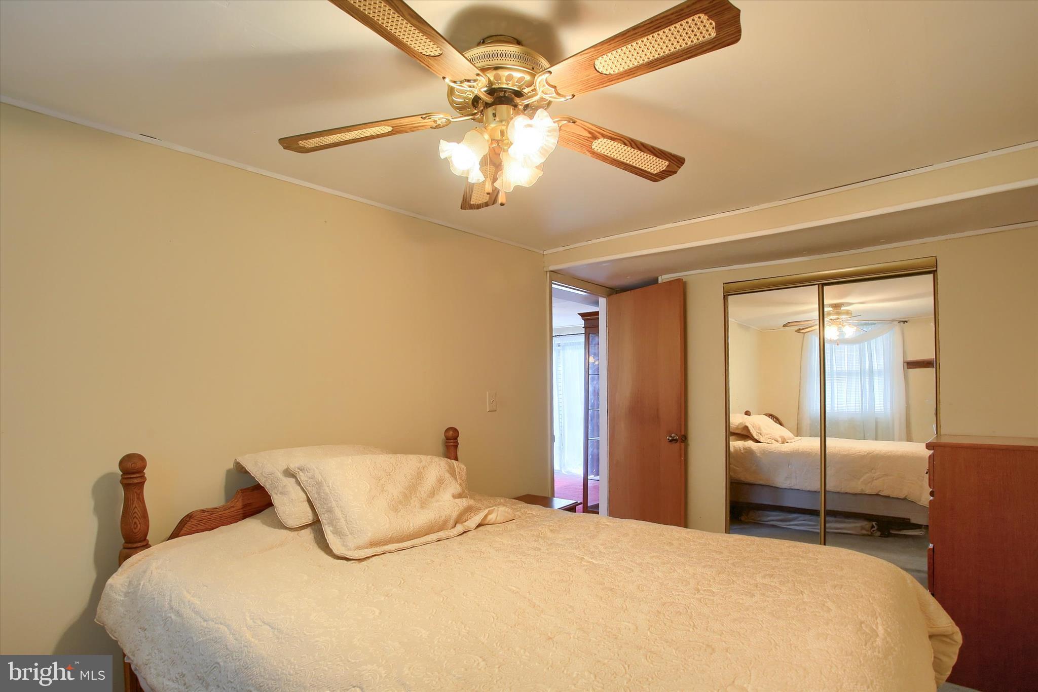 859 Pinetown Road Lewisberry, PA 17339 - Photo 26 of 51 a bedroom with a large bed and a chandelier