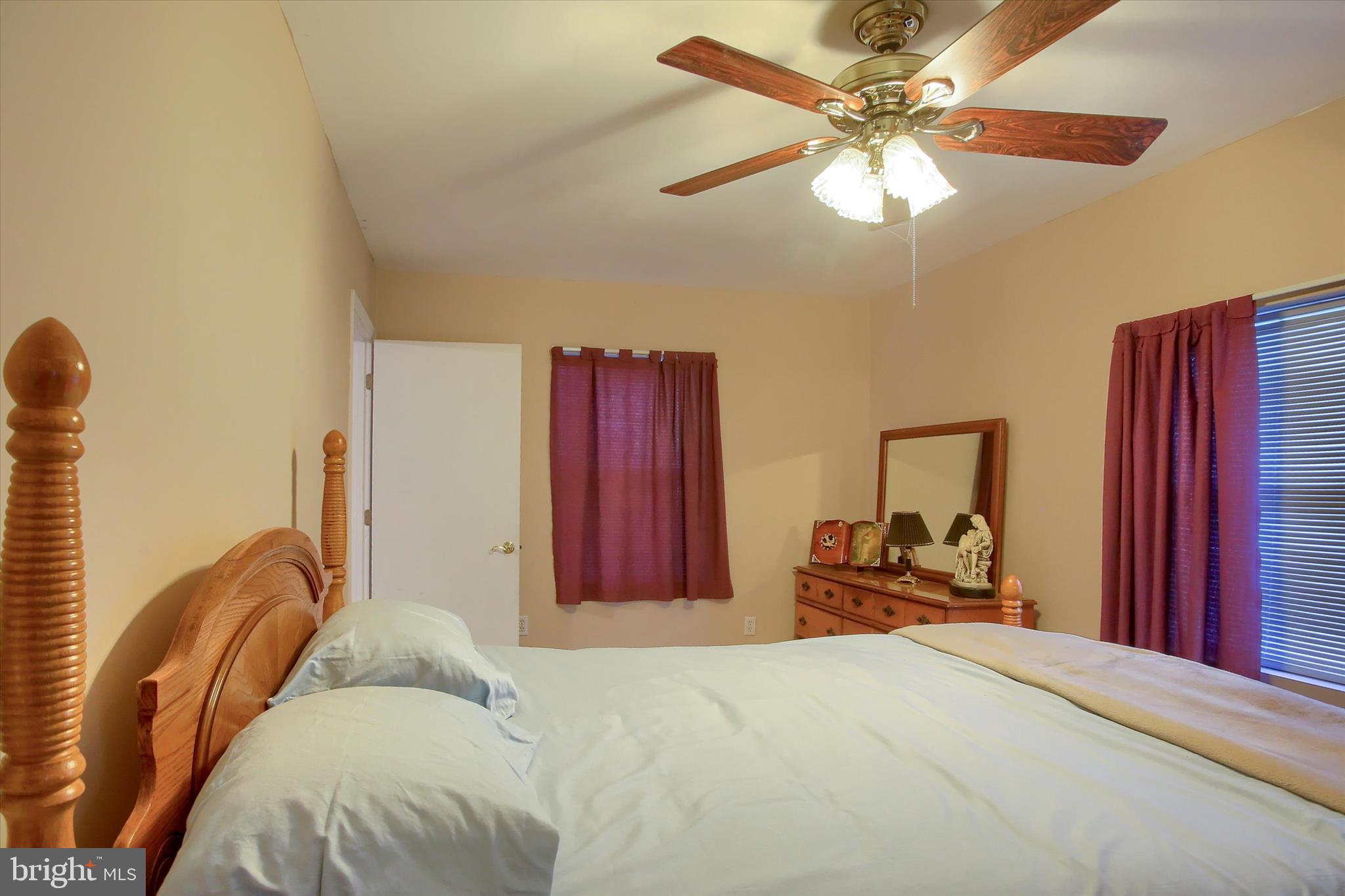 859 Pinetown Road Lewisberry, PA 17339 - Photo 41 of 51 a bedroom with a bed dresser and a large mirror