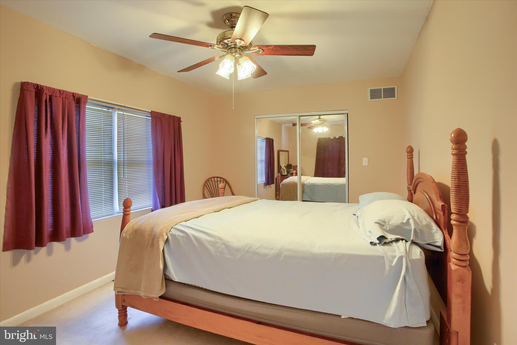 859 Pinetown Road Lewisberry, PA 17339 - Photo 42 of 51 a bedroom with a bed and a chandelier