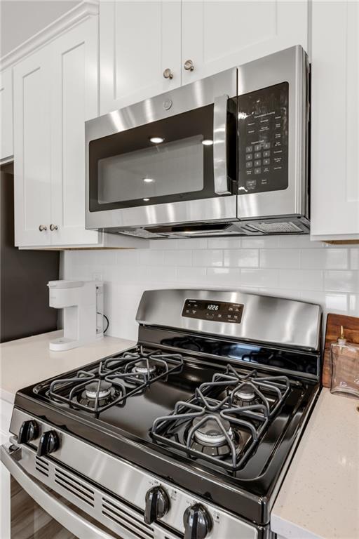 163 Sweet Water Lane Rome, GA 30161 - Photo 14 of 28 a stove top oven sitting inside of a kitchen