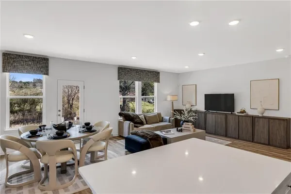 a kitchen with stainless steel appliances a sink stove top oven and cabinets