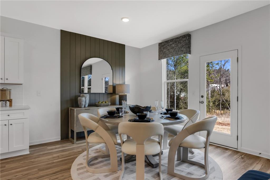 163 Sweet Water Lane Rome, GA 30161 - Photo 18 of 28 a dining room with furniture and wooden floor