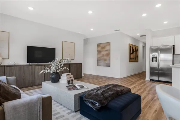 a bedroom with a bed and glass window