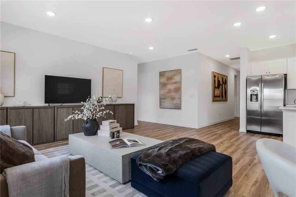 163 Sweet Water Lane Rome, GA 30161 - Photo 20 of 28 a living room with furniture and a flat screen tv