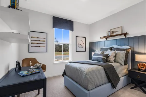 a bedroom with bed and window