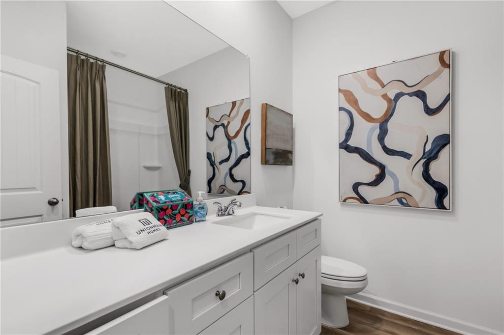 163 Sweet Water Lane Rome, GA 30161 - Photo 5 of 28 a bathroom with a sink and a mirror